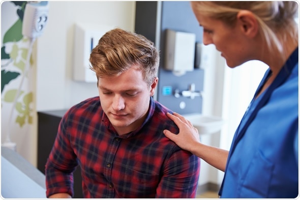 Male Patient Being Reassured By Nurse In Hospital Room - Image Copyright: Monkey Business Images / Shutterstock