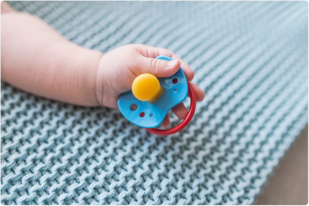 Baby with pacifier in hand - By Dragana Gordic