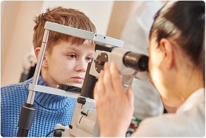 Young male patient in eye ophthalmological clinic. Image Credit: Dmitry Kalinovsky / Shutterstock