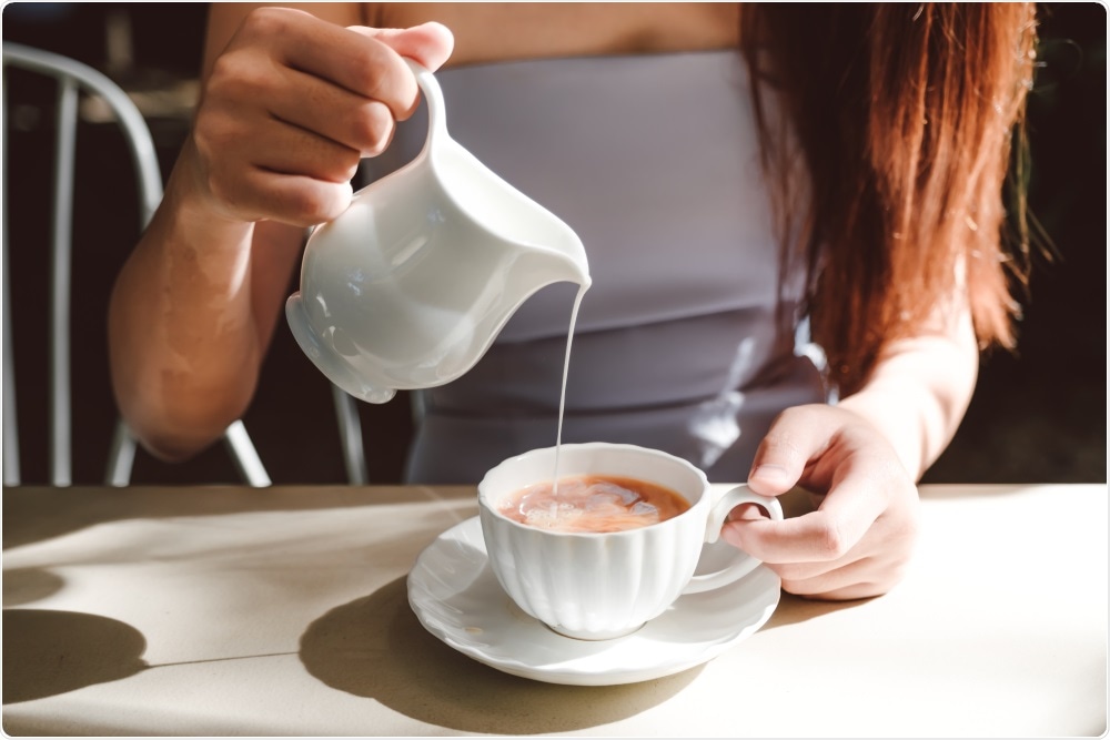 Woman stirring cup of tea