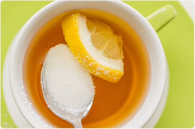 Spoon with sugar substitute, sorbitol. Image Credit: Photosiber/ Shutterstock