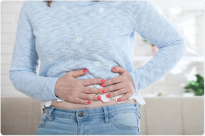 Abdominal pain. Image Credit: Miss Ty / Shutterstock