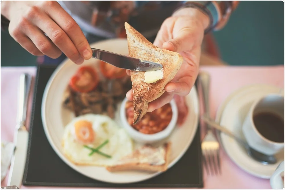 Person eating breakfast