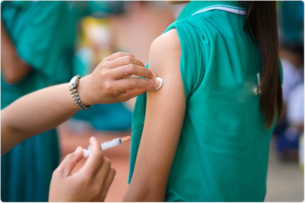 Young girl being given the HPV vaccine.