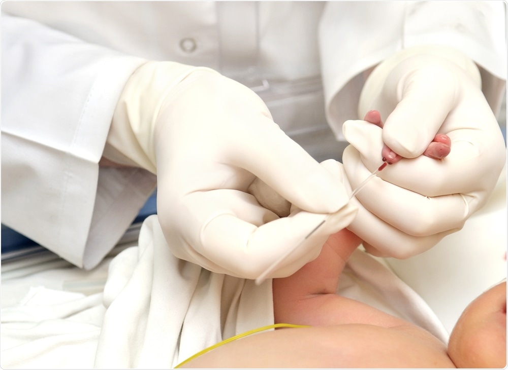 Doctor taking blood from baby