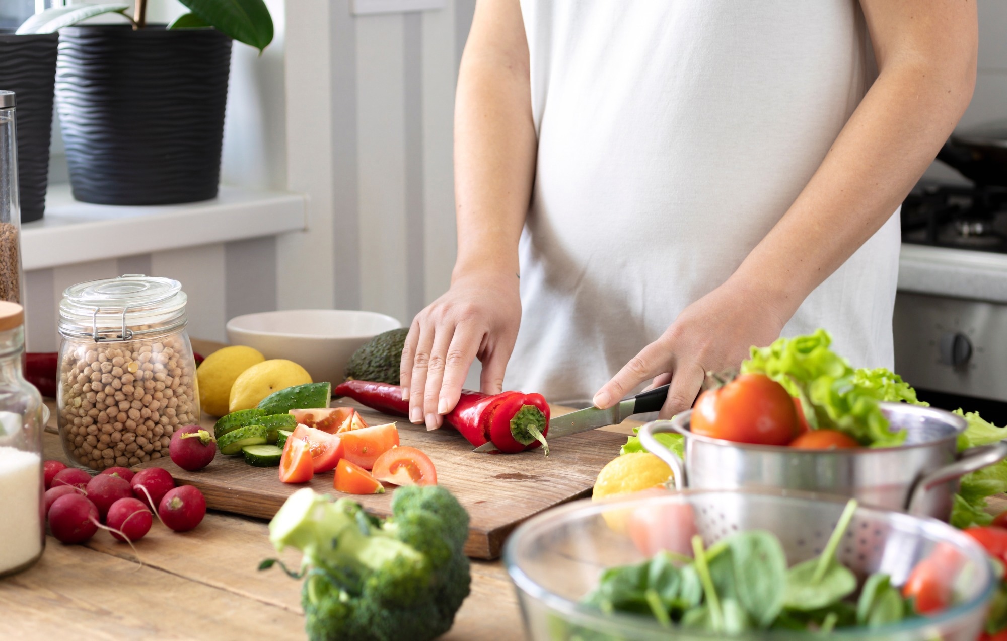 Woman cooking healthy vegetables.