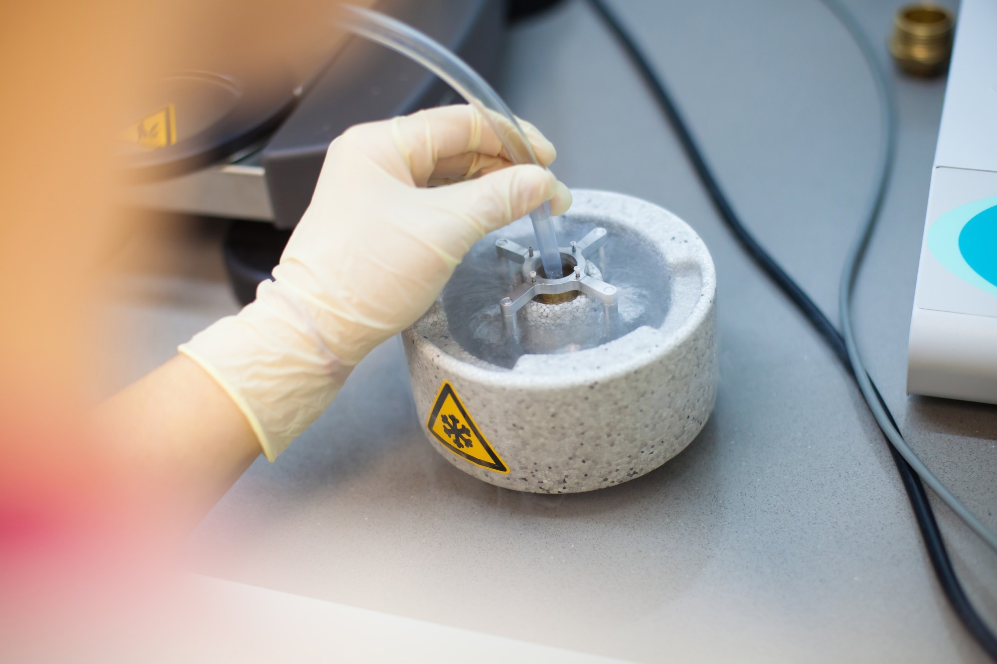Scientist preparing samples for Cryo electron microscopy in liquid ethane under liquid nitrogen temperature.