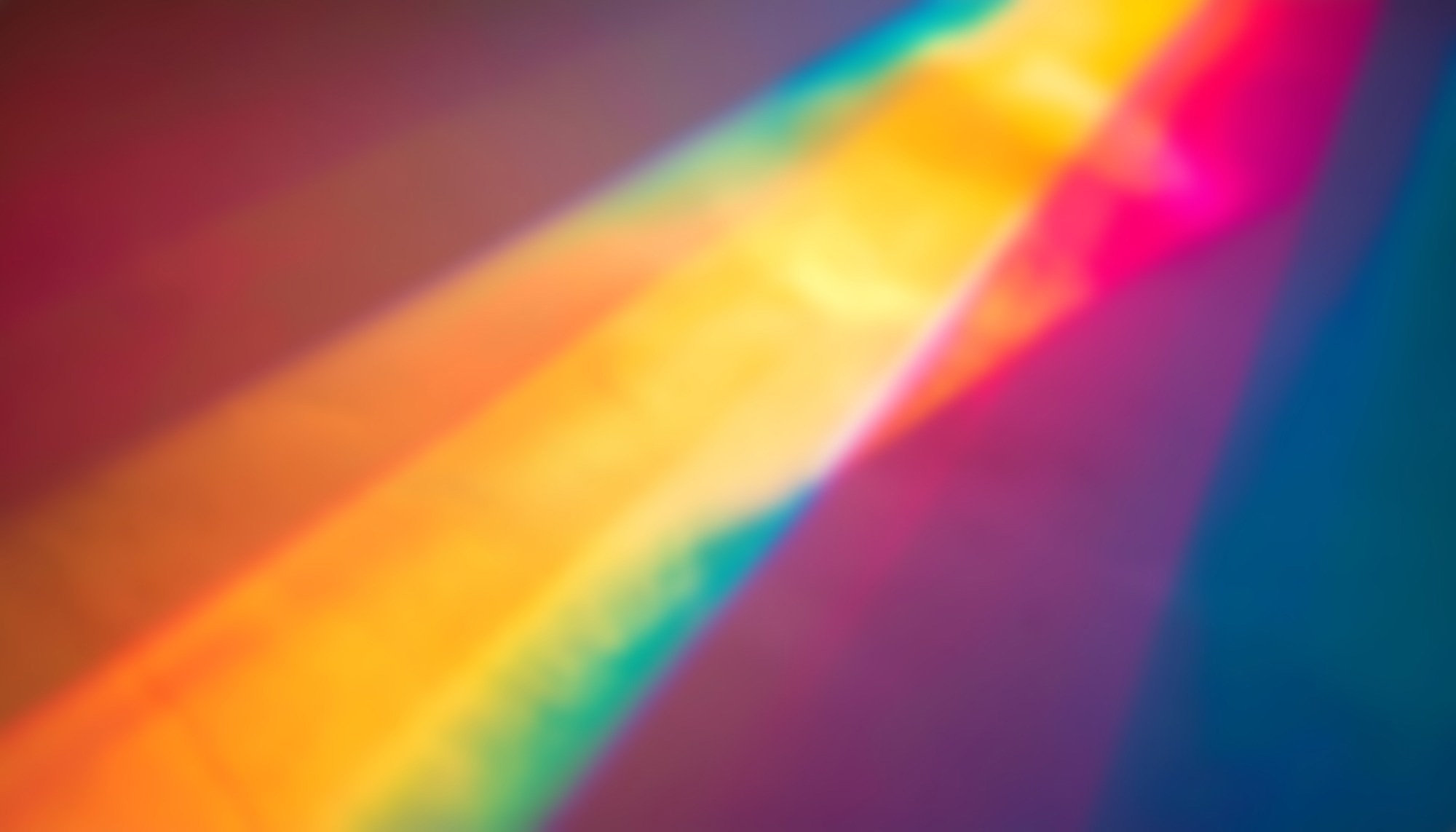 Soft diagonal prism spectrum gradient with vivid rainbow light beams and colorful glow