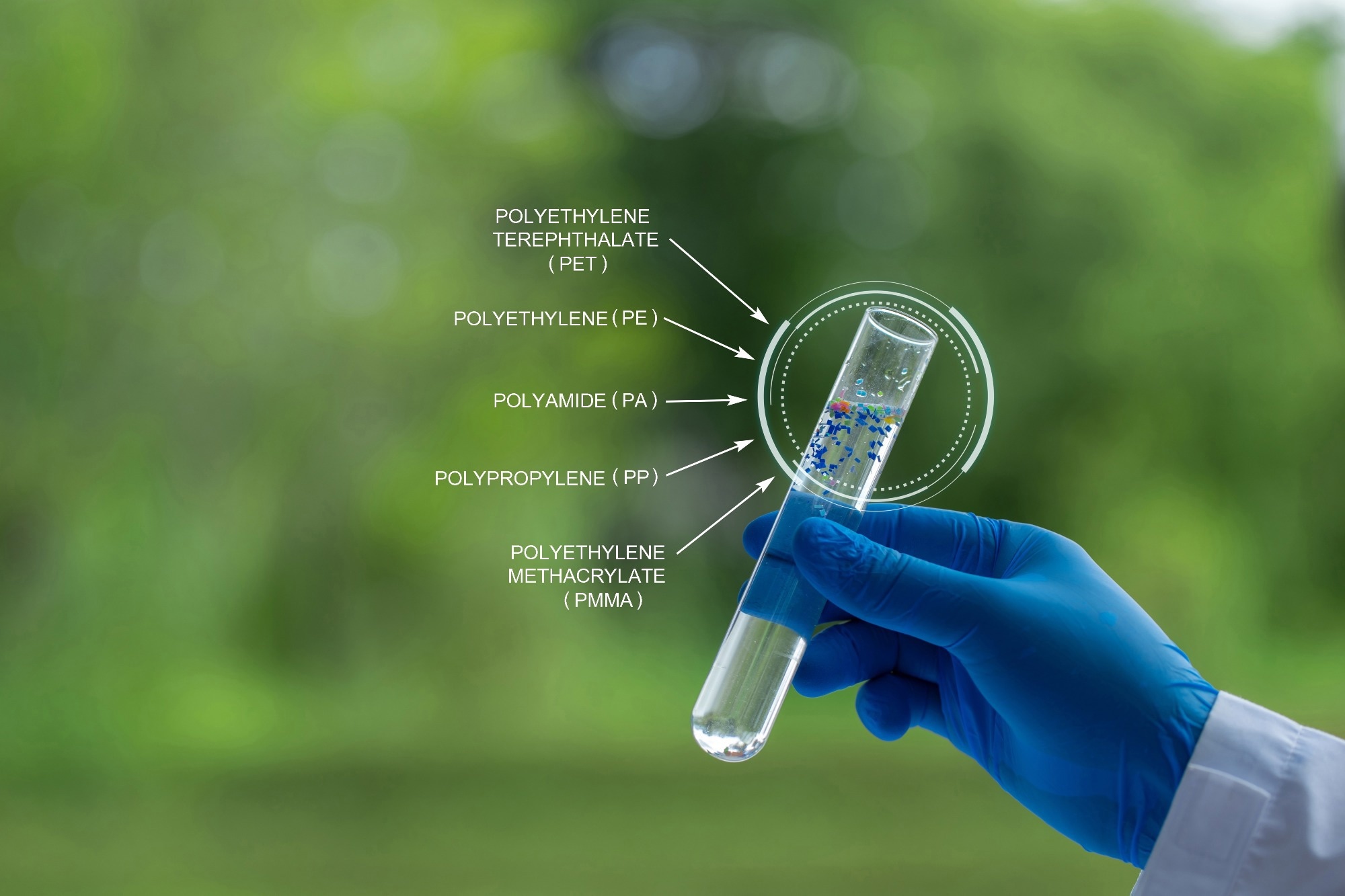 A scientist holding a test tube full of microplastics