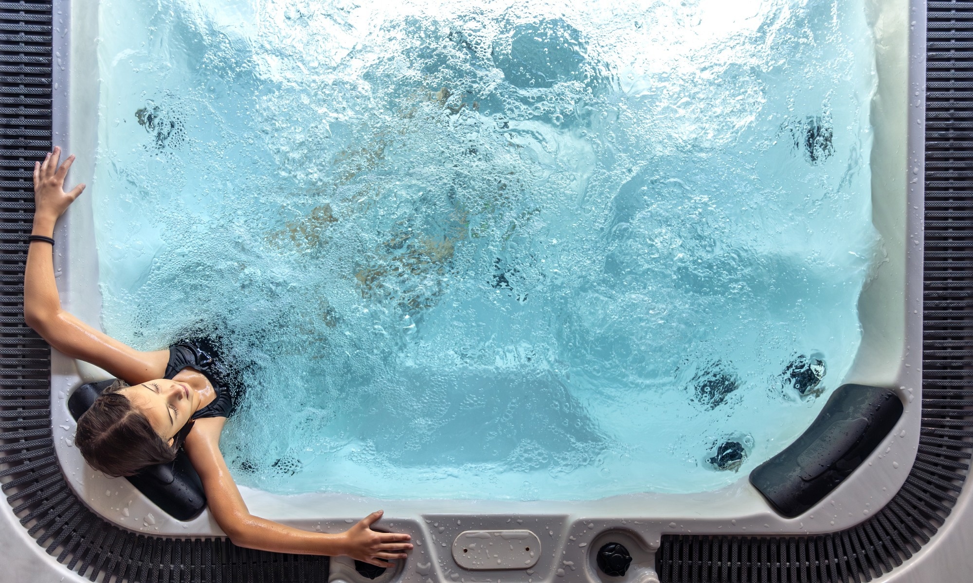 Woman sitting in hot tub