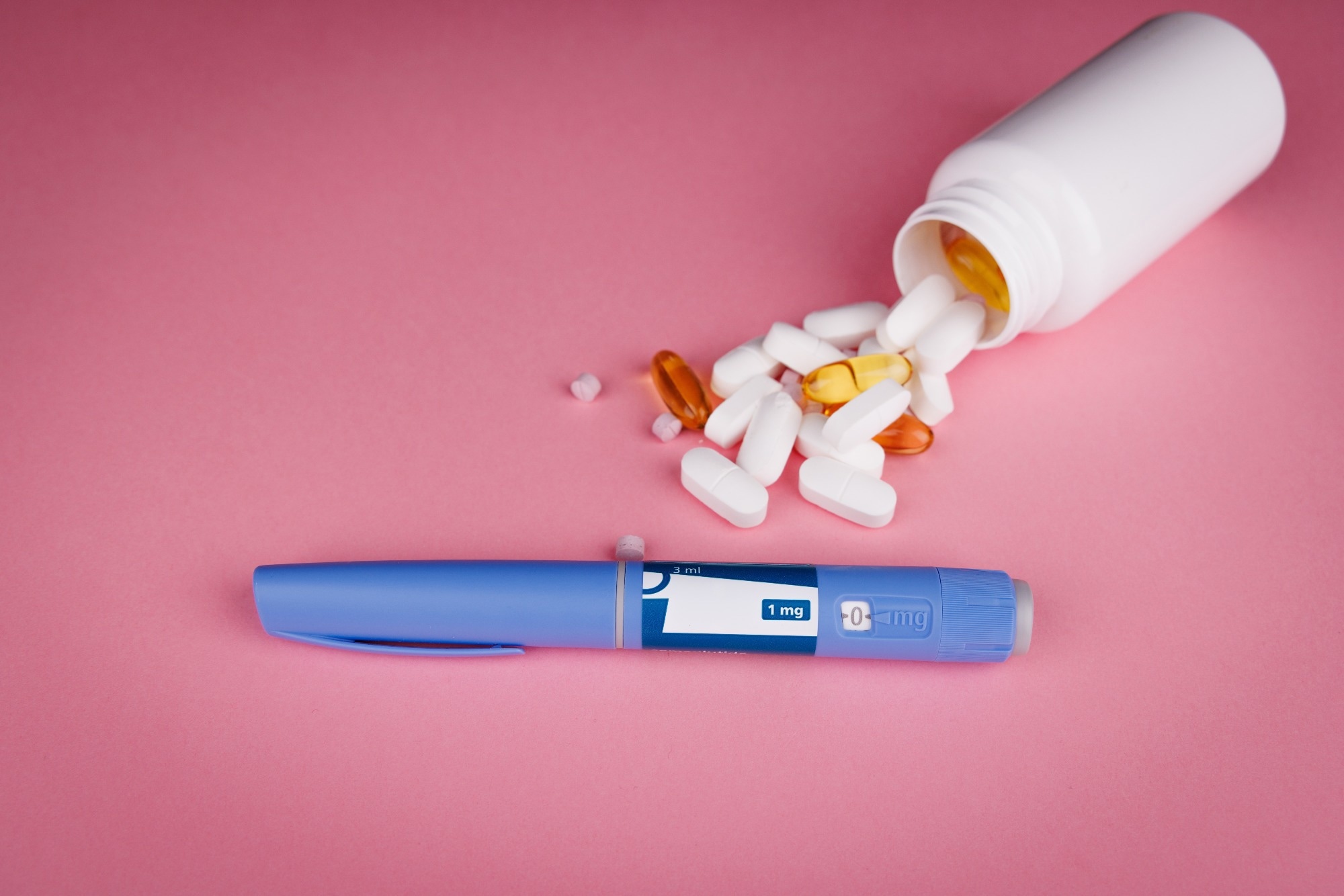 Spilling pill bottle and GLP-1 administration device.