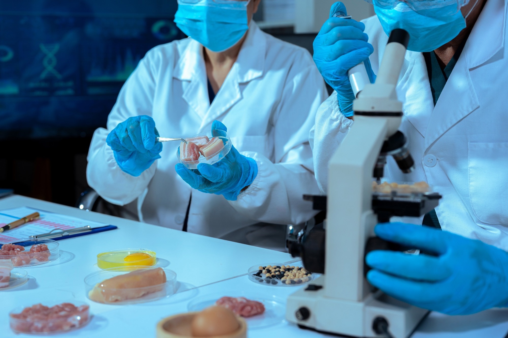Scientists examining food in laboratory