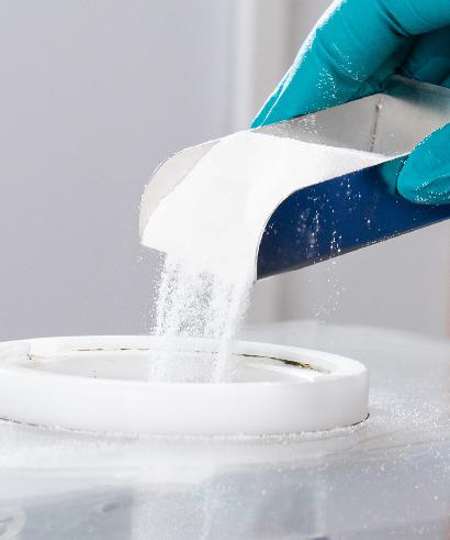 Powder being poured into a container