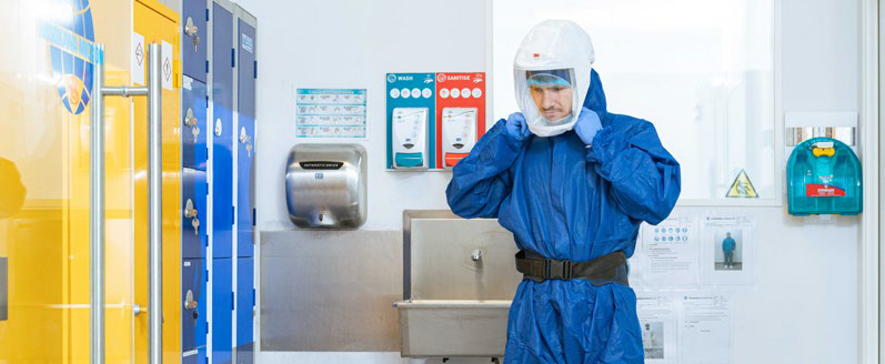 Male scientist wearing PPE