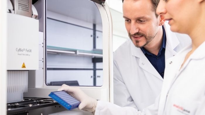 Two Analytik Jena scientists review a sample prior to CyBio sampling.