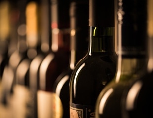 How can microbiota be used to make wine more health beneficial?