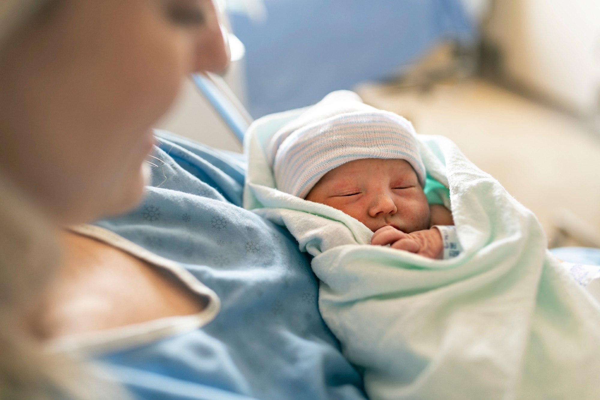 A Mother with her newborn baby at the hospital a day after a natural birth labor