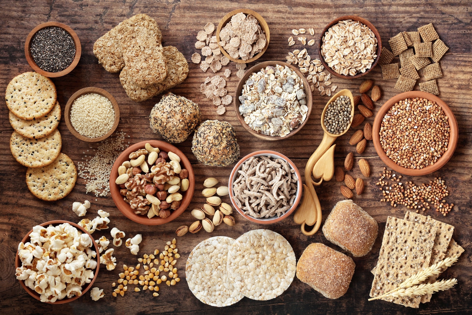 Variety of wholegrain foods including cereals, popcorn, crackers, nuts and seeds