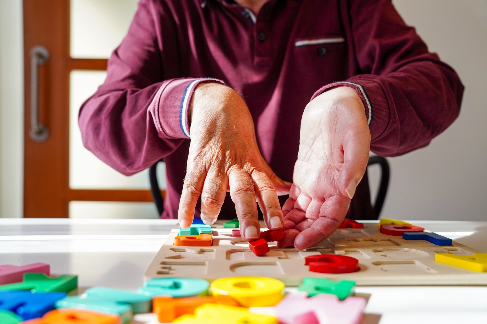 ALS person working on memory and coordination skills