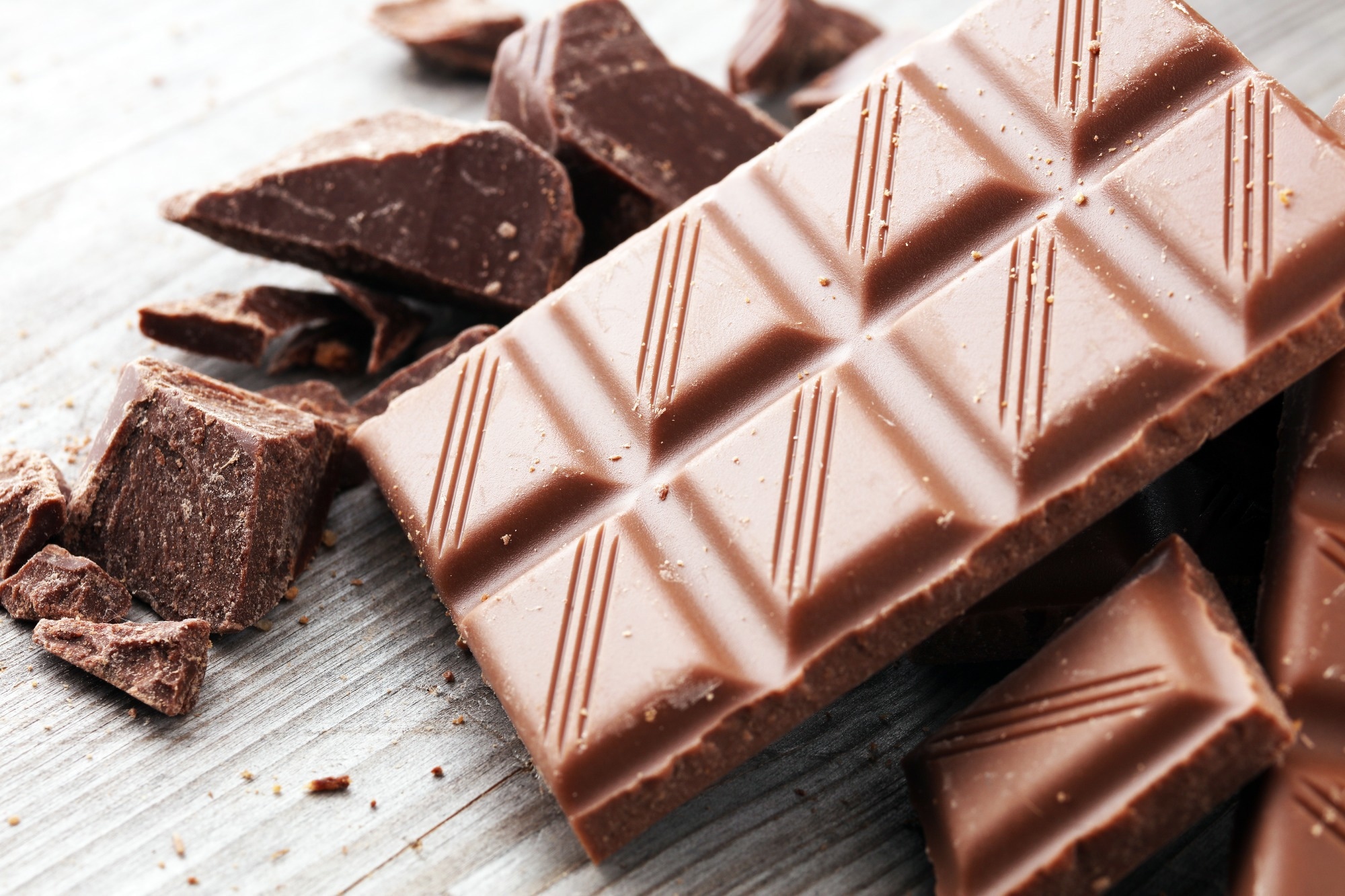 Dark Chocolate chunks and stacked broken chocolate bar.