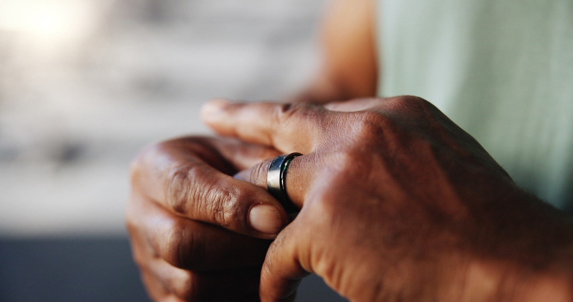 Smart ring, fitness and hands of man in gym for tracking exercise, training and workout progress. Sports, recovery and person rest with digital tech for wellness app, performance and stats for health